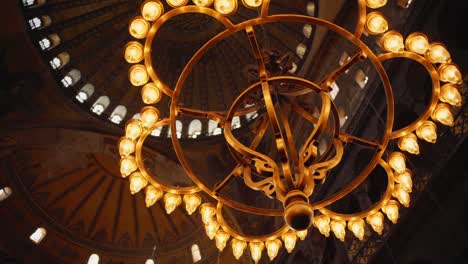 Ornate-Chandelier-Hanging-From-The-Dome-Of-Hagia-Sophia-Grand-Mosque-In-Istanbul,-Turkey