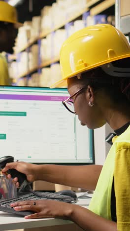 vertical video e-commerce worker scanning awb tags on cargo pallets for system registration