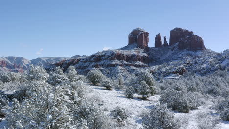 Aerial-Pan-6-of-Cathedral-Rock-near-Oak-Creek,-Sedona-Arizona---After-a-snowfall