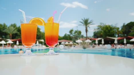 Bright-Impressions-Of-The-Beach-Holiday-Near-The-Pool-Two-Glasses-Of-Colorful-Alcoholic-Cocktail-On-