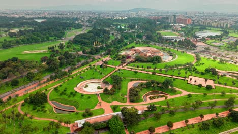 aerial orbit establishing the virgilio barco park and the virgilio barco public library with a circular architectural style, natural environment for recreation, bogota, colombia.