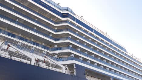 cruise ship with balconies and lifeboats