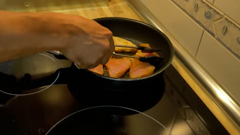 Turning-around-some-turkey-brests-fillets-in-a-skillet