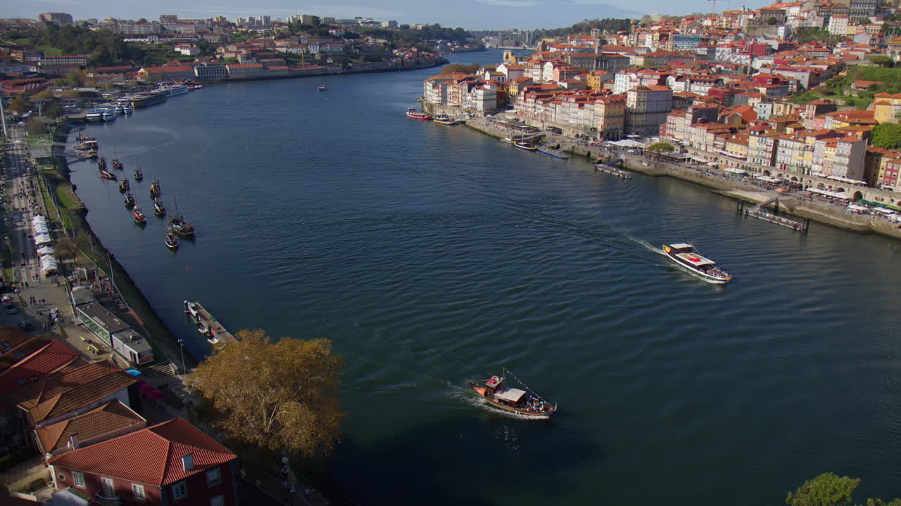 Boats On The Douro River On Sunny Day In Porto, Portugal. high angle shot, slow motion