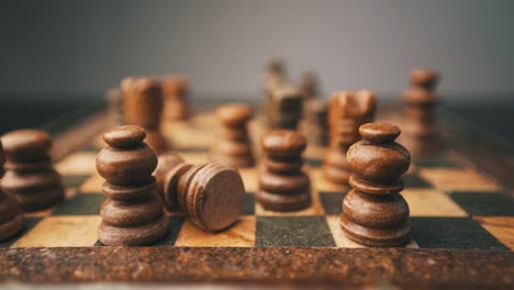 Chess-white-king-checkmate-falling-close-up-shot-chessboard