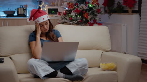 tired woman falling asleep while working on laptop