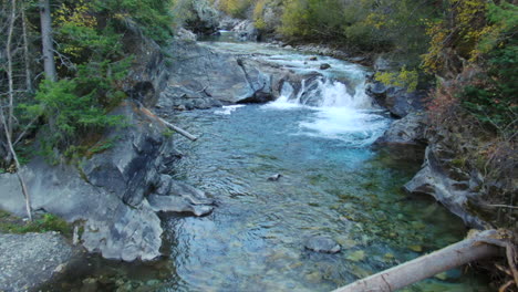 Marble-Crystal-Mill-Colorado-scenic-aerial-drone-cinematic-fall-autumn-Southern-Colorados-late-afternoon-sunset-cloudy-shaded-down-the-river-landscape-pan-reveal-backwards-movement