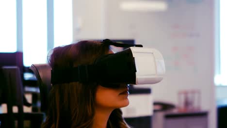 Female-executive-using-virtual-reality-headset