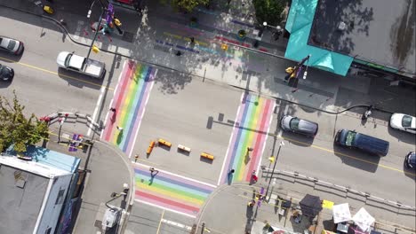 super slow aerial twist over gay pride lgbtq downtown community with 4 painted road flags describing sexuality of the village davie and bute vancouver canada 2-2