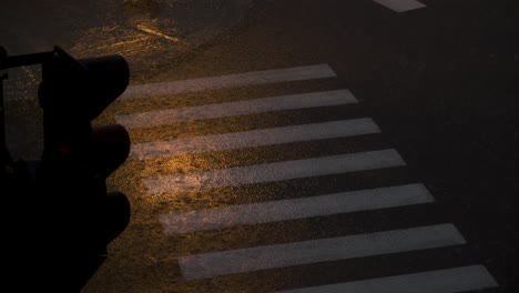 Pedestrian-crossroad-under-heavy-rain-on-a-summer-night-rainstorm