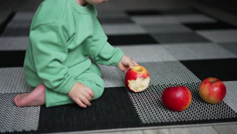 baby eating an apple