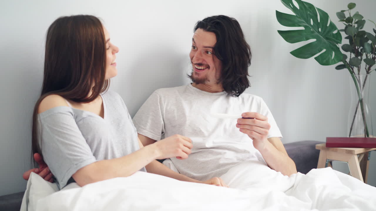 Excited Couple Reacts to Pregnancy Test Result