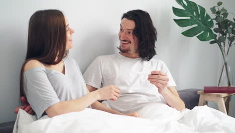Excited Couple Reacts to Pregnancy Test Result