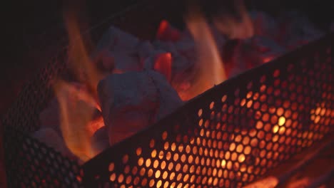 Hot-coals-burn-brightly-inside-a-barbeque-in-anticipation-of-the-meat