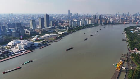 aerial drone cityscape of shanghai, china, downtown with huangpu river landscape