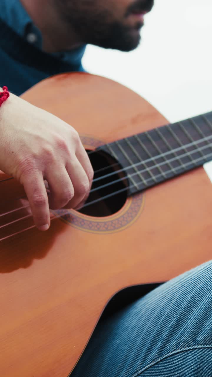 Hands of a Guitarist Rehearsing Outdoors