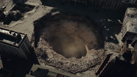 aerial view of a large hole in the middle of a city
