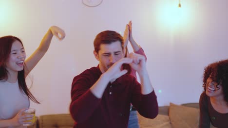 man dancing while woman circle him on a party