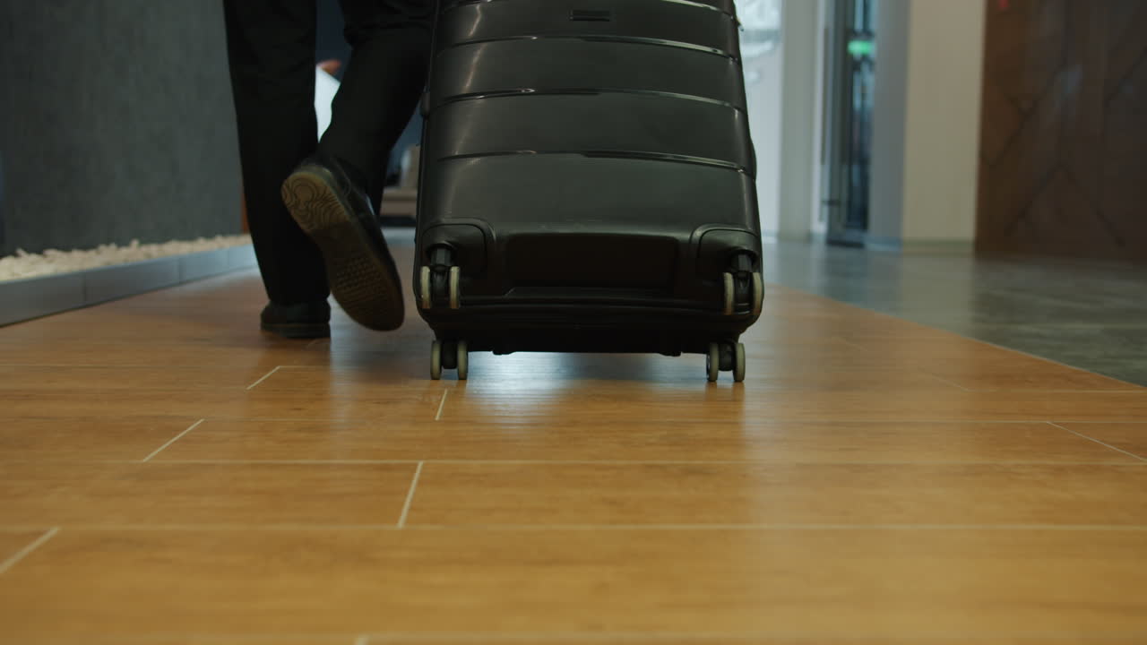 Hotel Concierge Assisting with Luggage