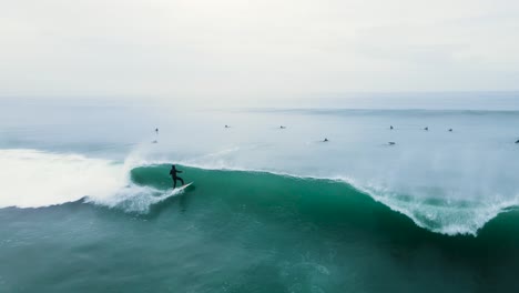 Surfer-launching-off-a-wave-in-carlsbad