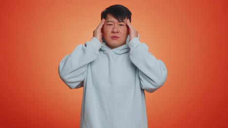 man rubbing temples to cure headache problem suffering from tension and migaine stress pain
