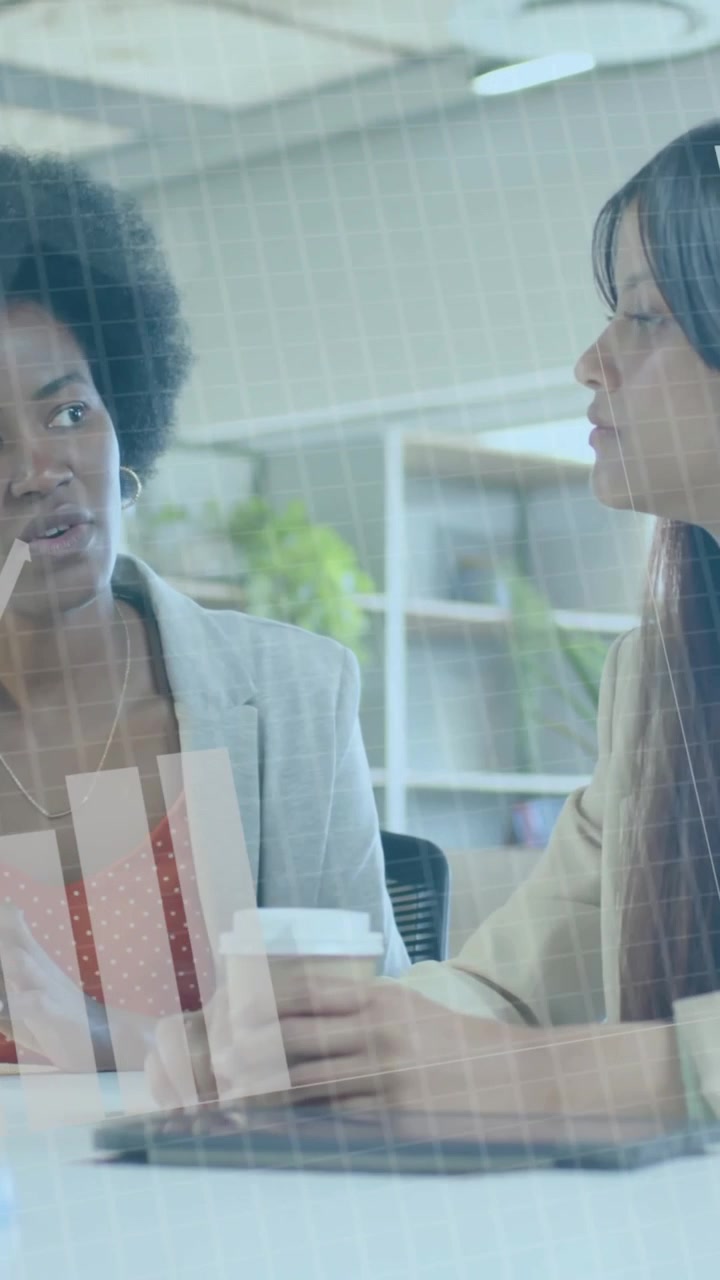 Animation of financial data processing over diverse businesswomen in office