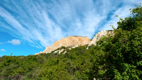 clay cliffs framed by lush greenery, a harmonious blend of nature's wonders in a serene landscape