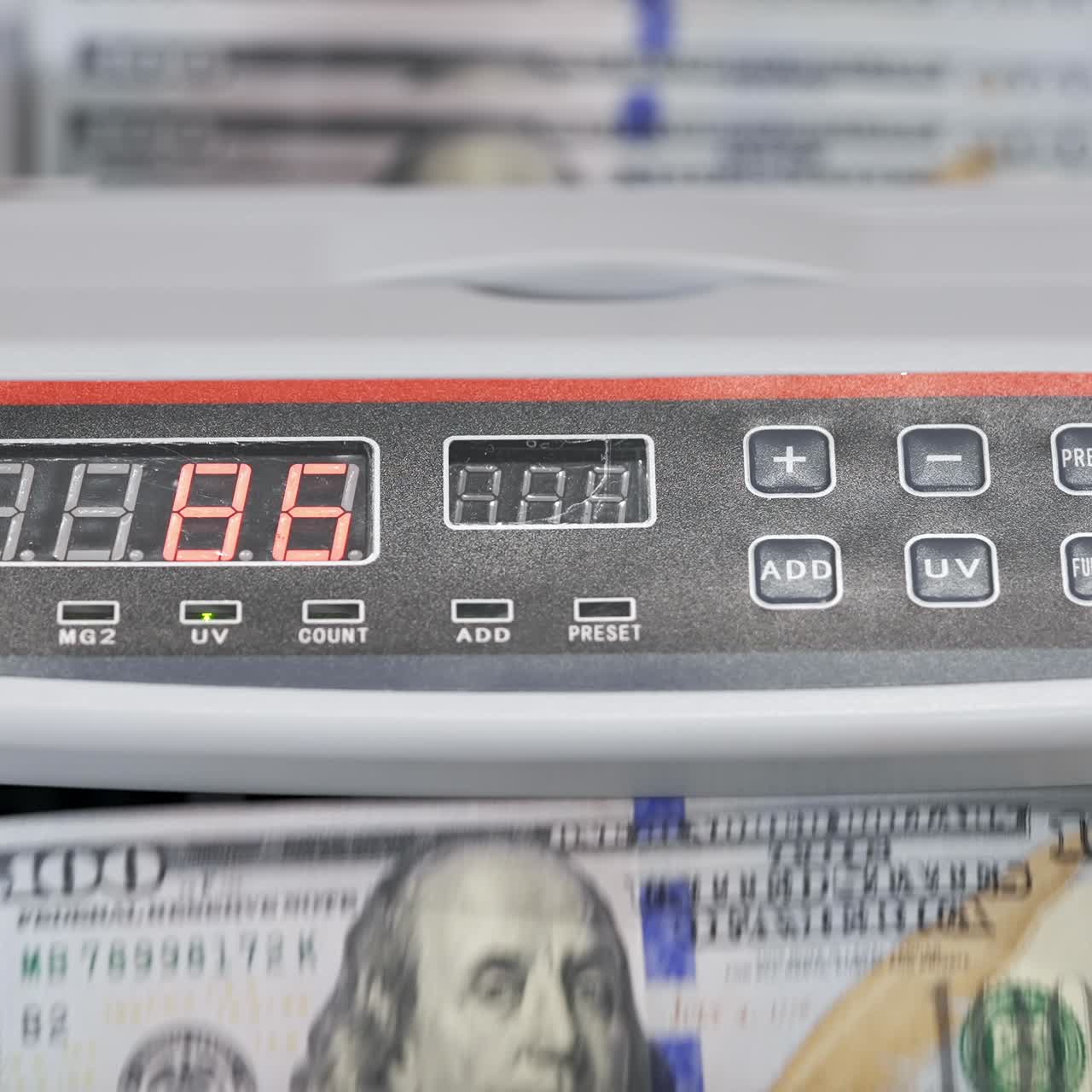Money counting equipment for paper money calculation. US national paper currency. Automatic mechanism for bank financial operations