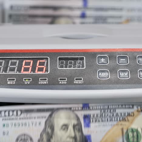 money counting equipment for paper money calculation. us national paper currency. automatic mechanism for bank financial operations