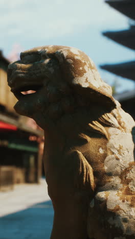 stone komainu statue at a japanese temple