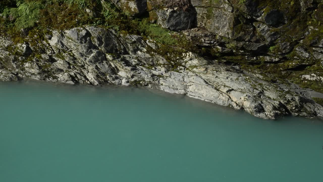 Rocky Cliffs With Turquoise-blue Water At Hokitika Gorge Near Kokatahi On The West Coast Of New Zealand. Close-up Shot