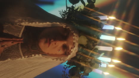 tattooed man with candle wreath praying