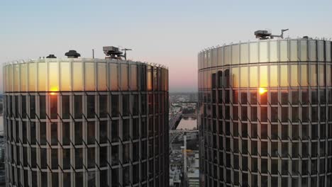 Aerial-close-up-view-roof-top-of-glass-office-buildings-on-sunset-in-Riga,-Latvia