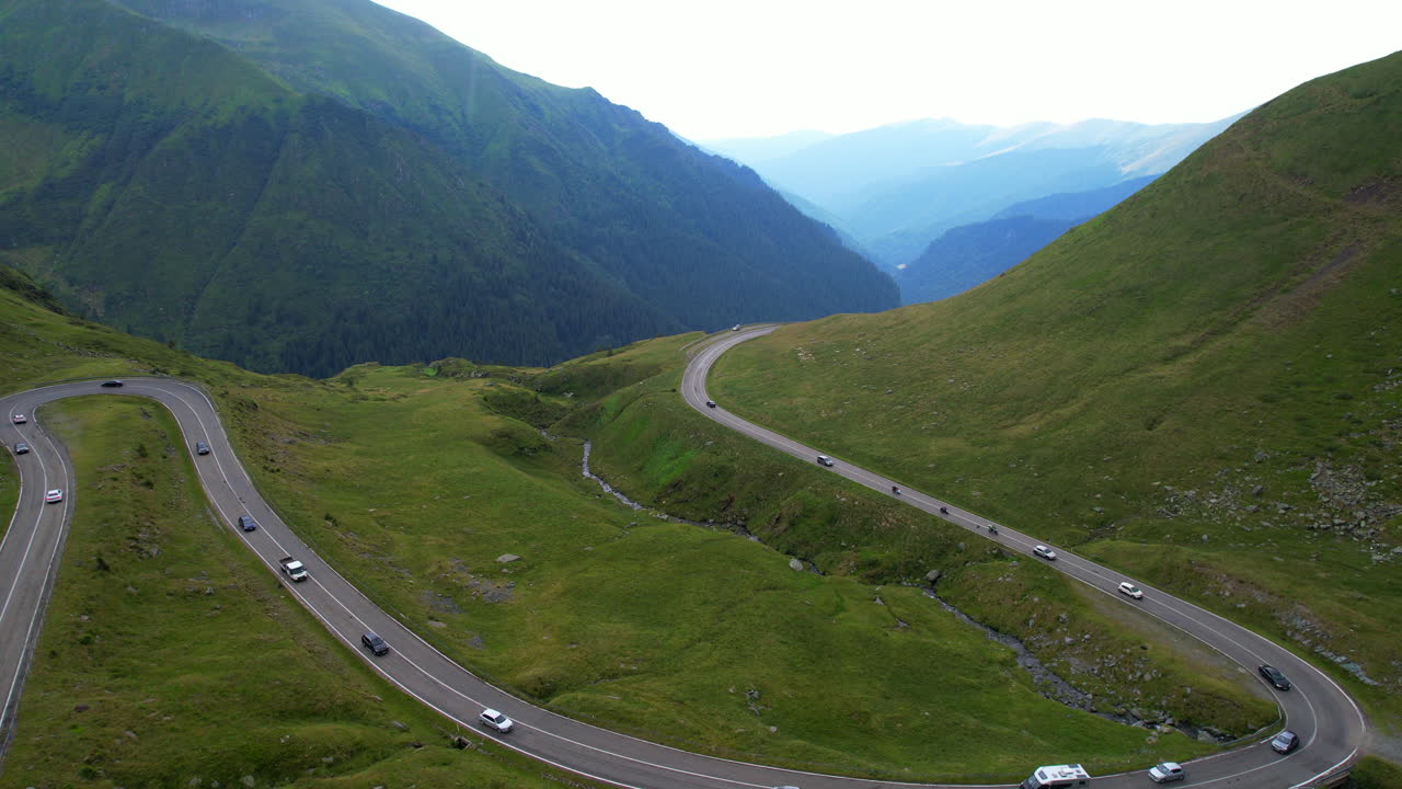 Vehicles crossing Transfagarasan in the Carpathians, Romania. Aerial
