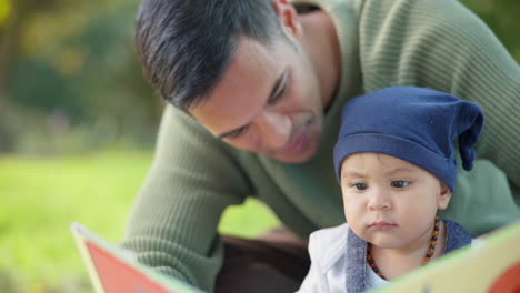 book, baby and father reading a story