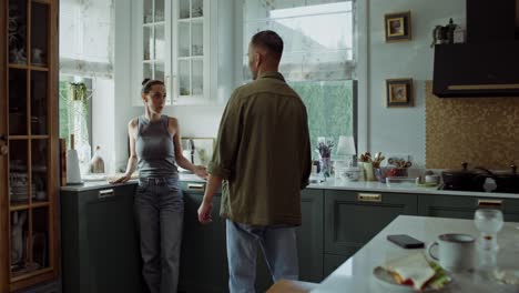 couple arguing in kitchen