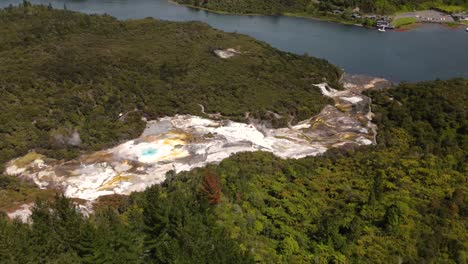 Orakei-Koraku,-popular-geothermal-attraction-in-New-Zealand---aerial-establish-shot