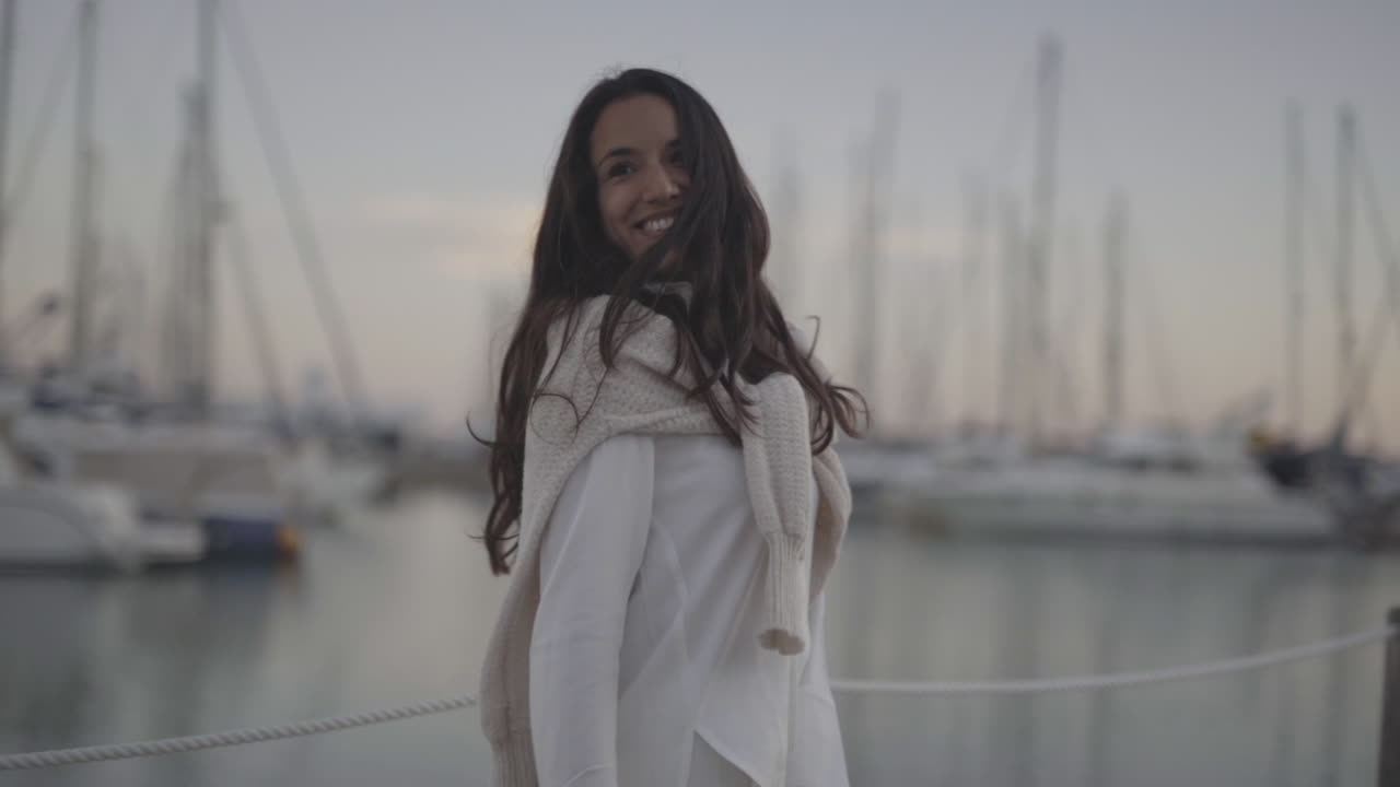 Happy lovely day at Barcelona harbour Spanish model posing for winterwear