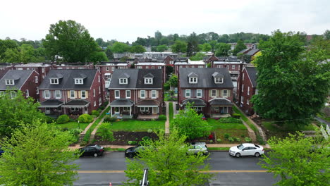 Aerial-truck-shot-of-city-neighborhood-on-overcast-spring-day