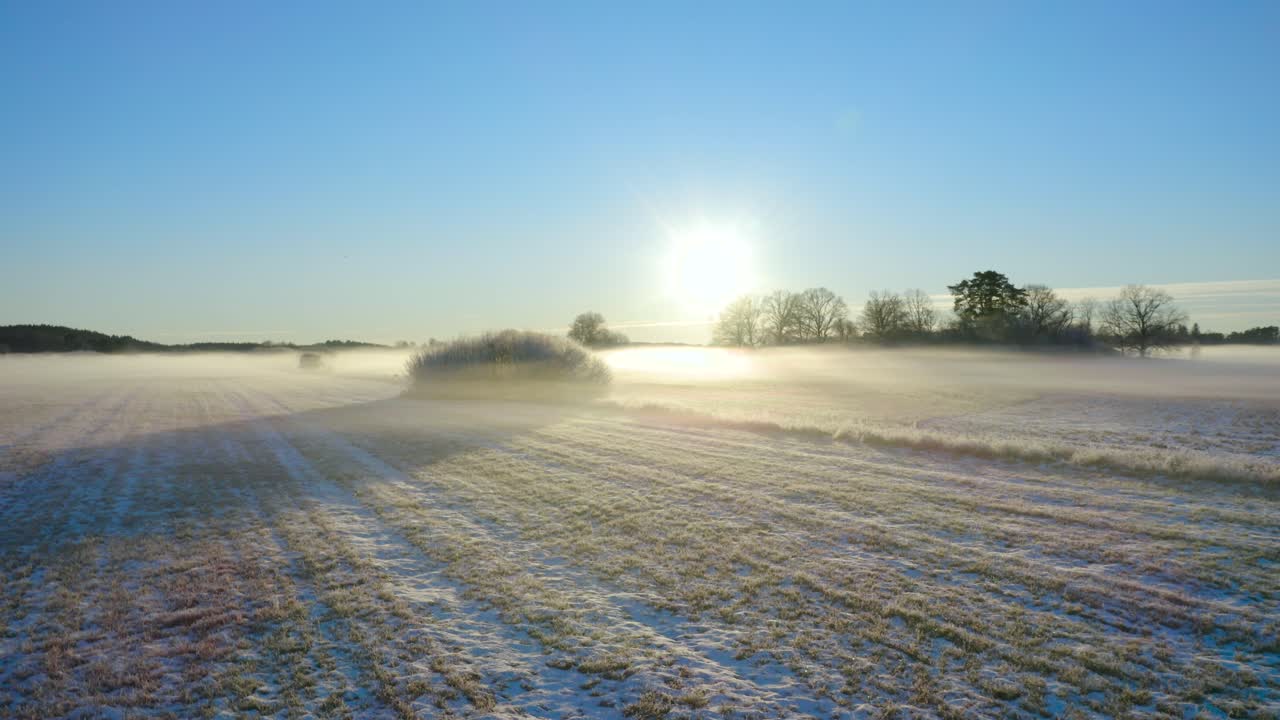 fields at sunset 2 - frozen mist during winter in sweden - aerial