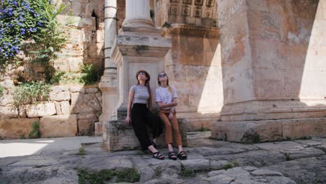 two girls tourist enjoying old city view. travel guide, tourism in europe with friends