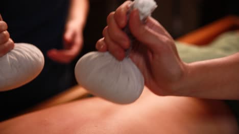 thai massage with herbal compresses