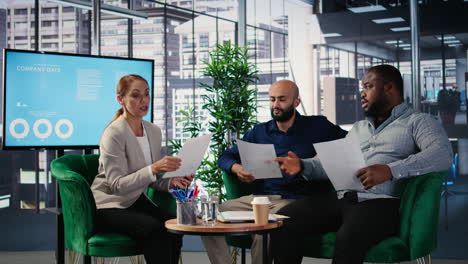 vertical video woman business leader interrupting a meeting for an insightful phone call