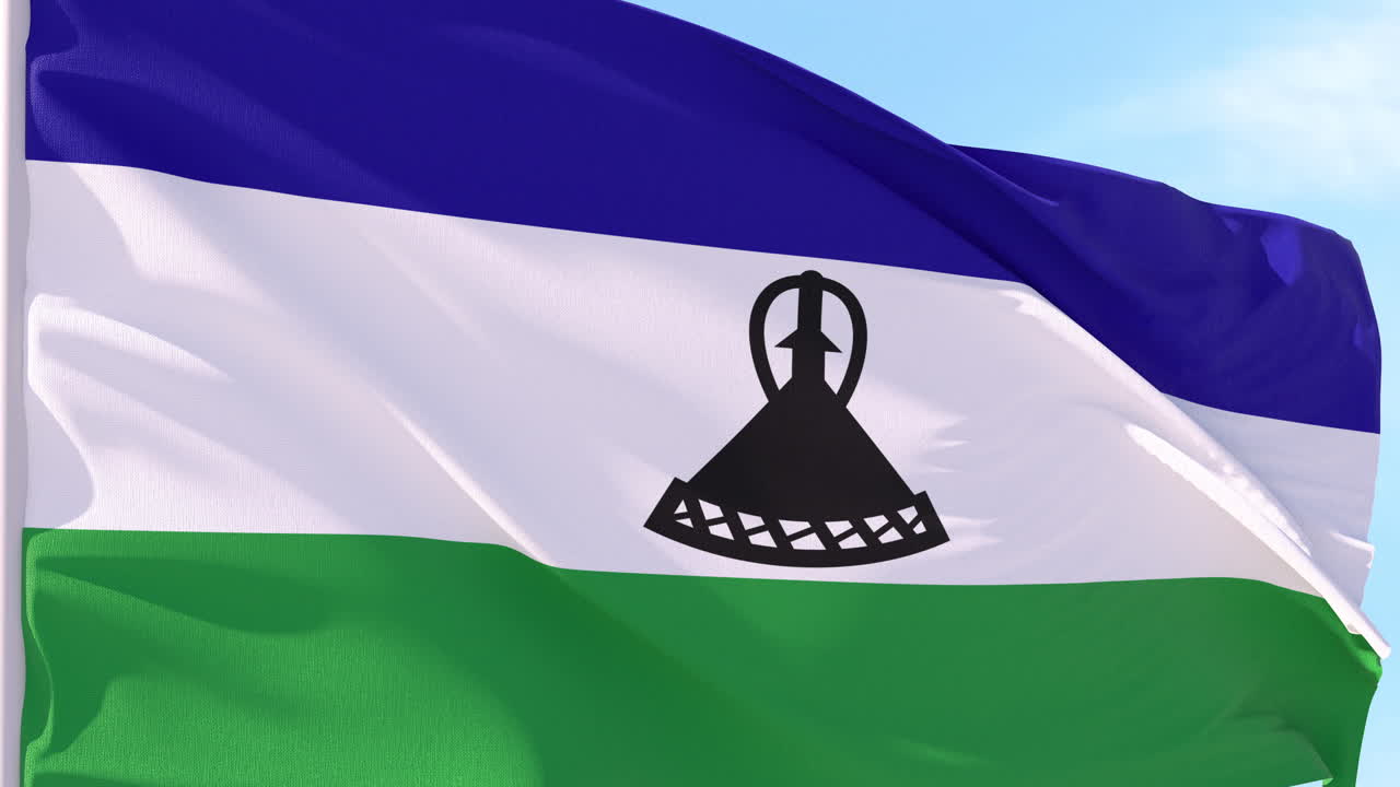 Bandiera del Lesotho che sventola al vento contro un cielo blu