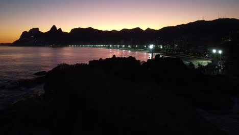 silhouette of the rio de janeiro mountains close to the beach