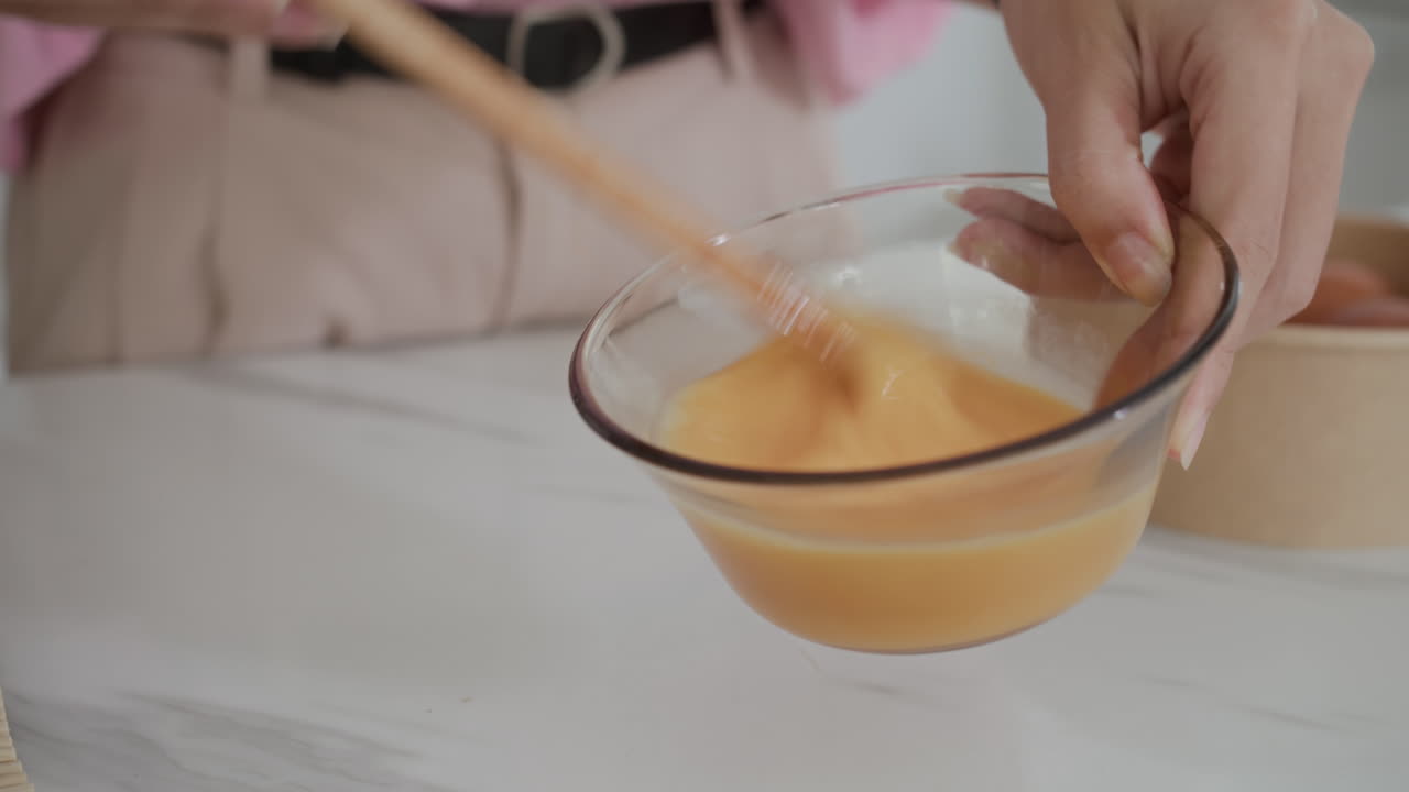 Anonymous Woman Beating Eggs in Bowl at Home Kitchen