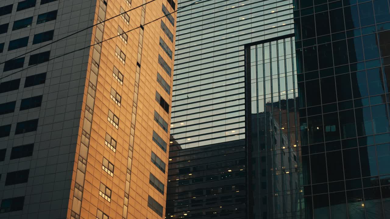 Glass And Concrete Skyscrapers In Gangnam, Seoul, Glowing With Sunset Reflections. Prominent District In South Korea. low angle shot