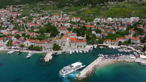 old port town of bol on the island brac in central dalmatia, croatia. aerial drone shot