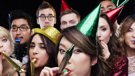 multi-ethnic group of people celebrating birthday party slow motion photo booth