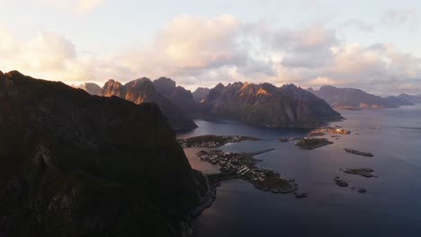 Aerial-view-of-Reine,-Hamnøy-and-Reinebringen-at-sunset,-golden-hour,-Lofoten-Islands,-Norway